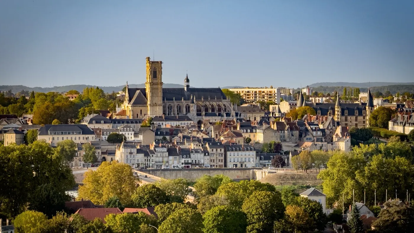 A view over the rooftops of Nevers, the cathedral tower rising above the trees