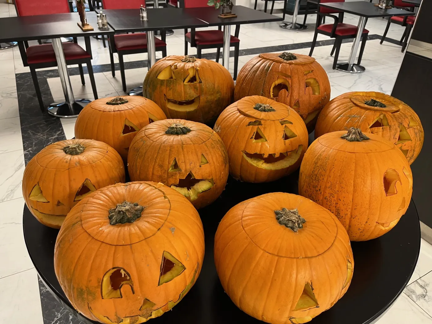 The carved pumpkins lined up with their grinning faces, ready for the party