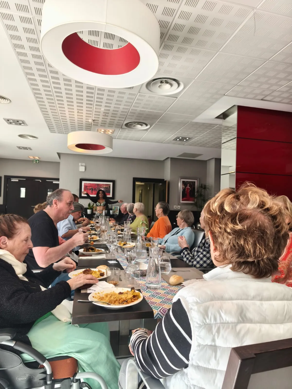Residents eating together along the festive table