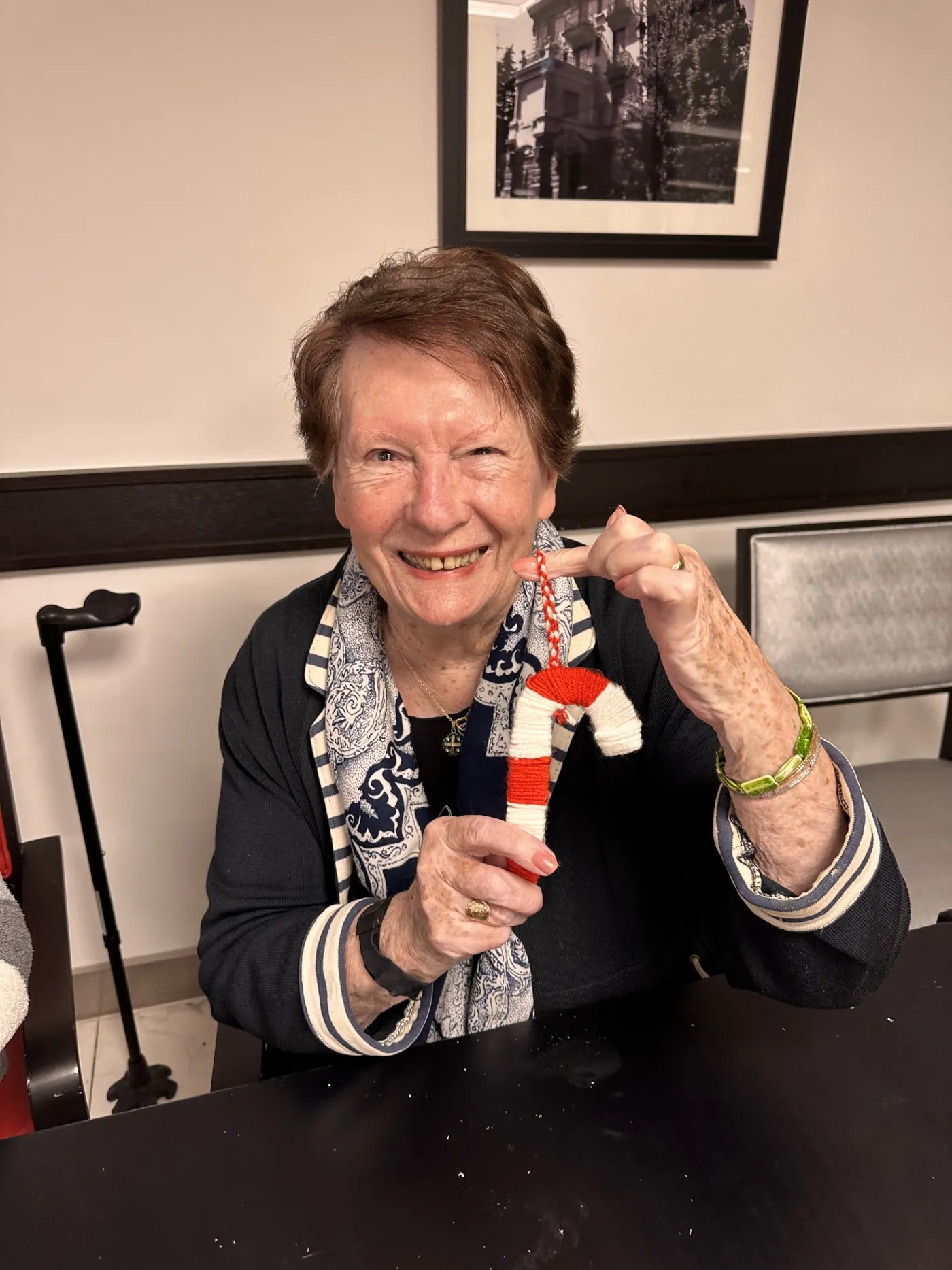A resident showing the little Father Christmas figure she has made