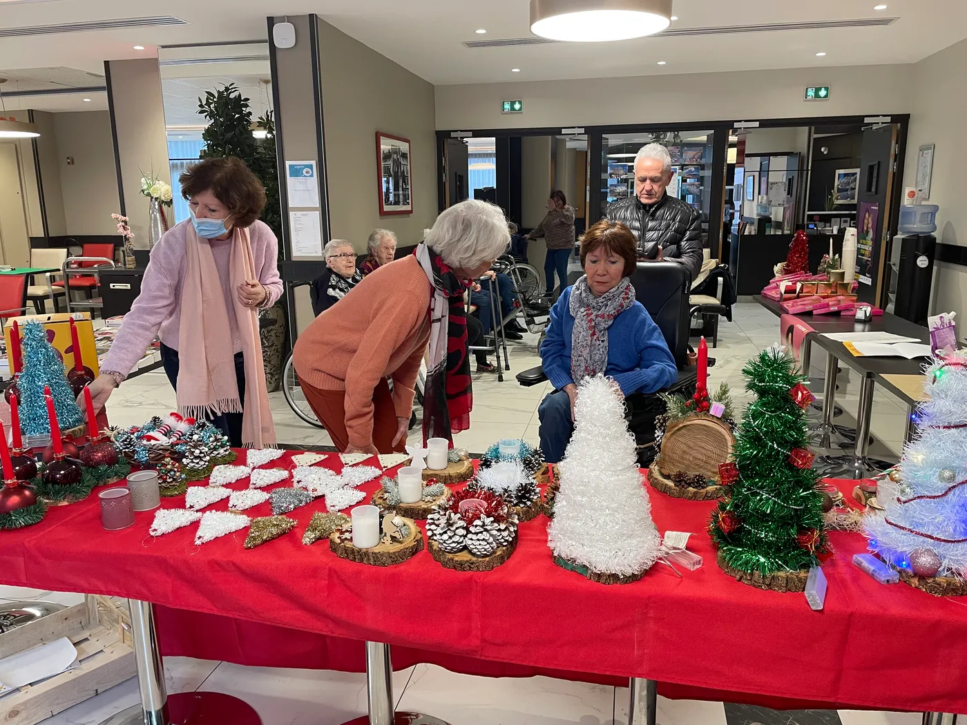 The Telethon stall with its red cloth covered in handmade Christmas decorations