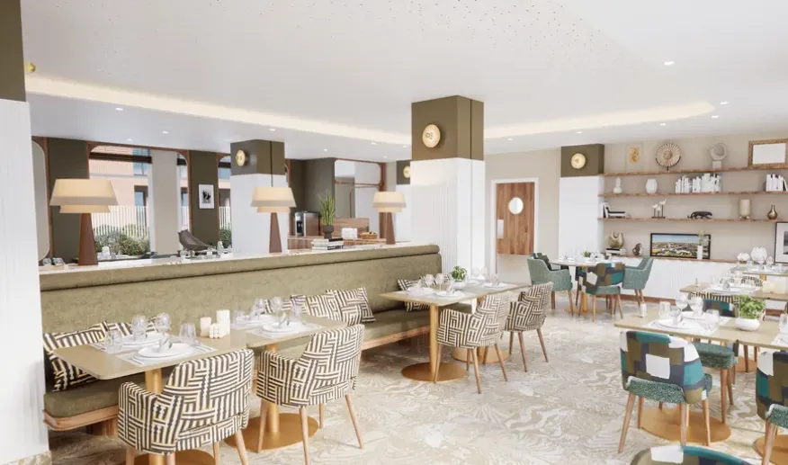 Restaurant area of the OBEO Toulouse-Guillaumet senior residence: laid tables and graphic chairs in a warm, convivial atmosphere
